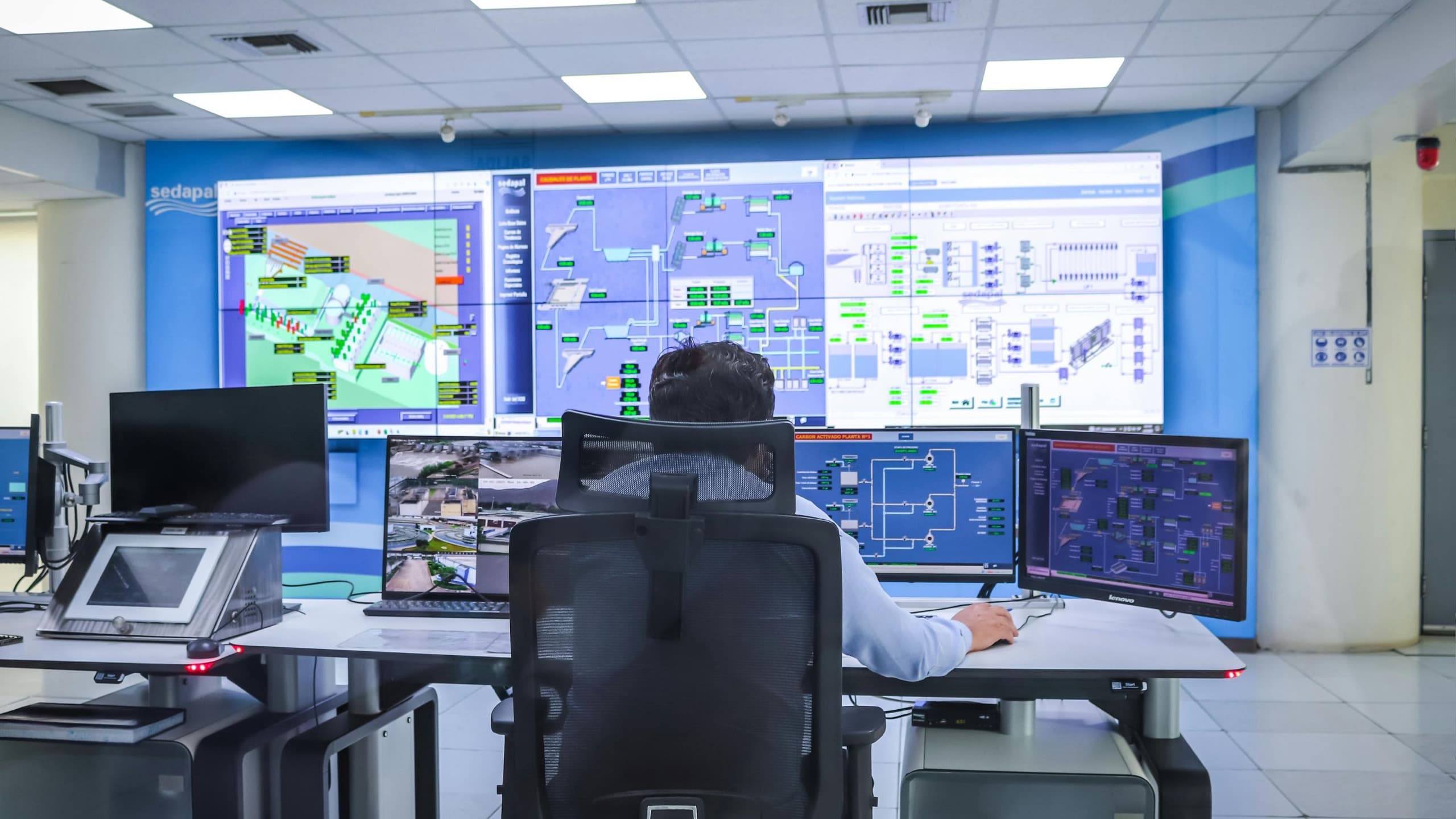 Industrial control room with monitoring screens