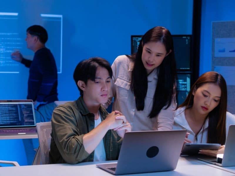 Team reviewing test scenarios on screen